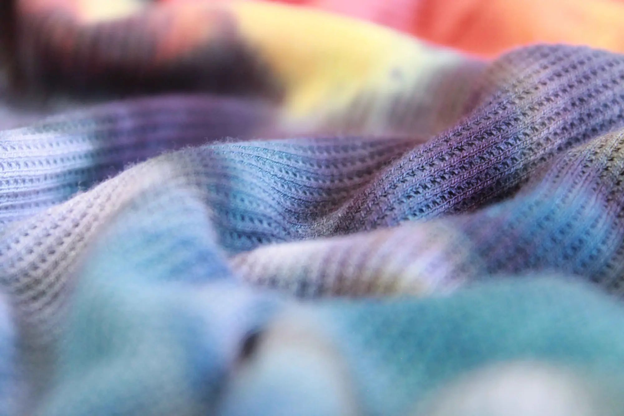 Soft knitted fabric with pastel blue and purple tie dye pattern in Color My Clothes collection.