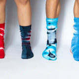 Colorful tie-dye socks in red, navy, turquoise, and light blue made from bamboo rayon