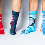 Colorful tie dye socks in red, navy, and light blue made from bamboo rayon clothing