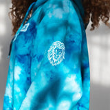 Tie dye blue sweatshirt featuring a white lion logo from Detroit Lions Unfinished Business Hoodie