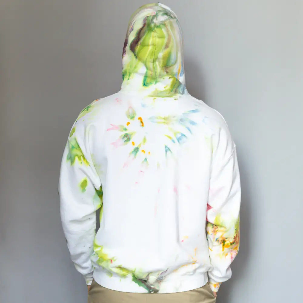 White tie-dyed DDH Hoodie with green and yellow splashes, stylish clothing option