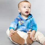 Baby in a tie dye blue hoodie and cream pants, modeling an adorable Kid Jacket