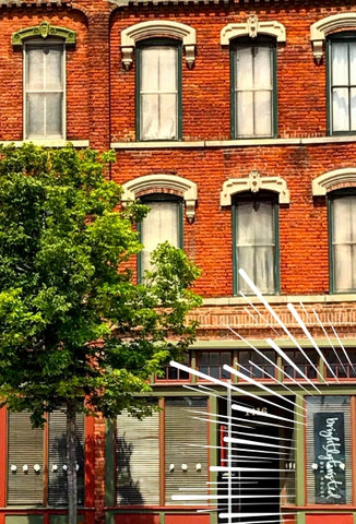 Historic red brick building with arched windows near BrightlyTwisted Store on Michigan Avenue