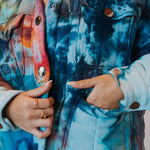 Tie-dyed Angie Jacket featuring vibrant orange and blue swirled patterns