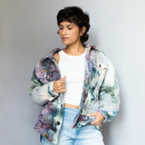 Angie Jacket tie-dyed puffy winter jacket in purple, teal, and white marbled pattern