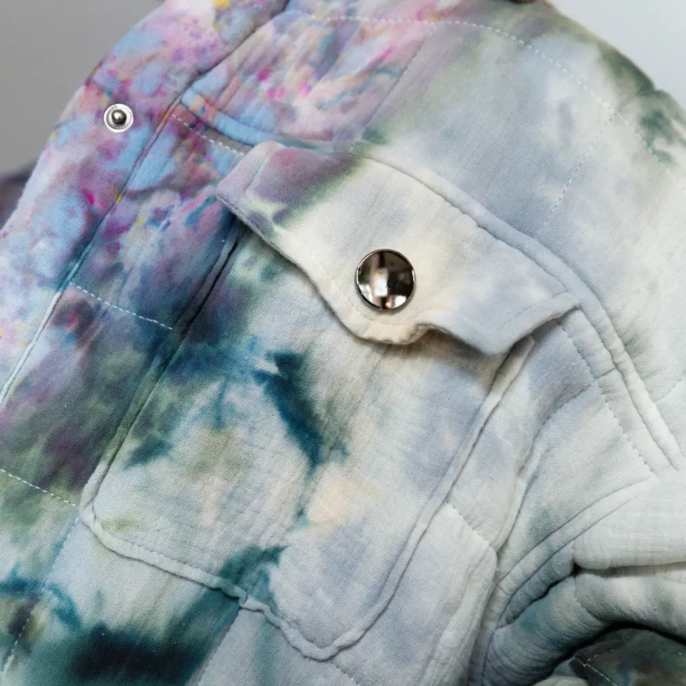 Tie-dyed denim pocket of Angie Jacket featuring a metallic snap button detail