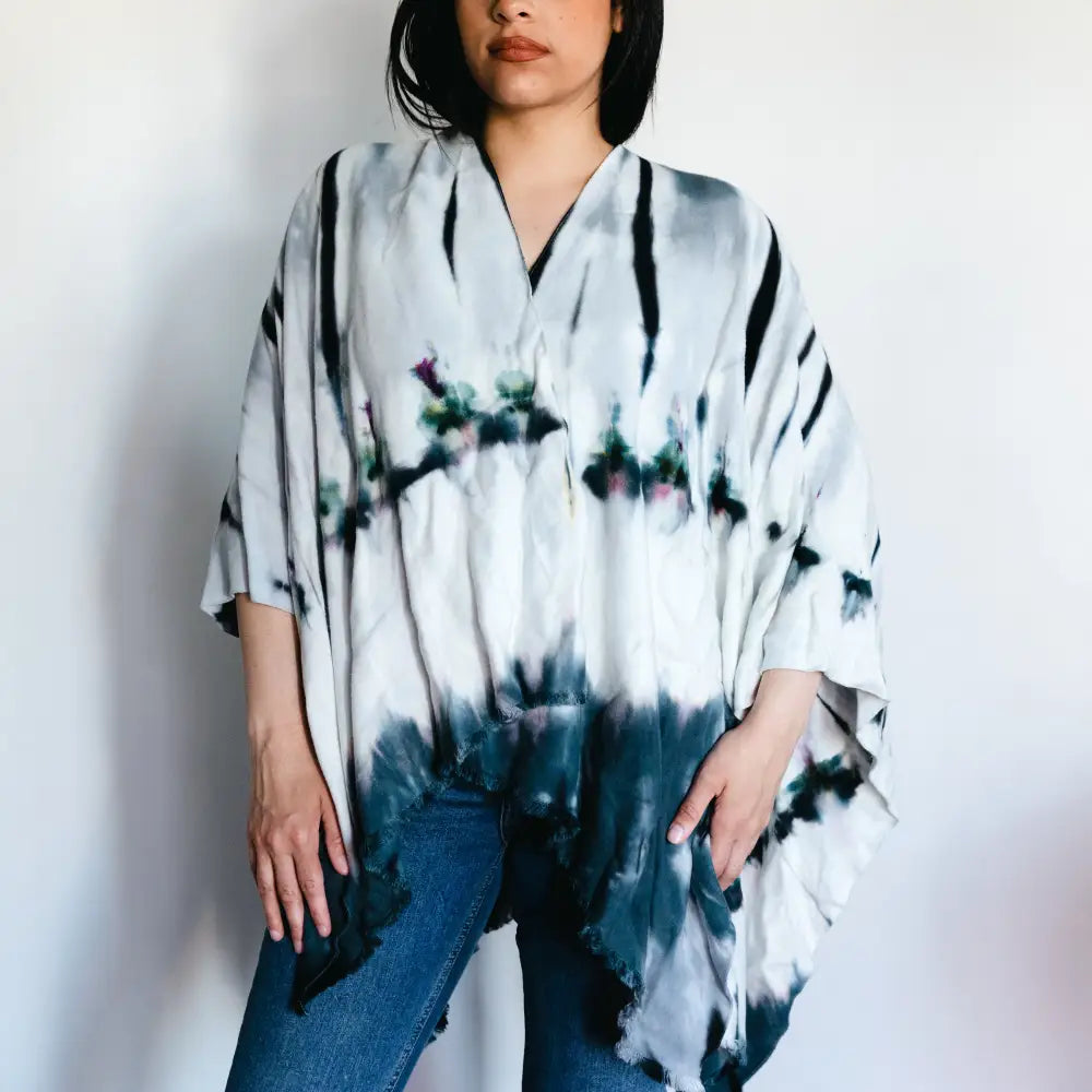 White and navy blue tie dye kimono-style wrap top with flowing sleeves for stylish clothing