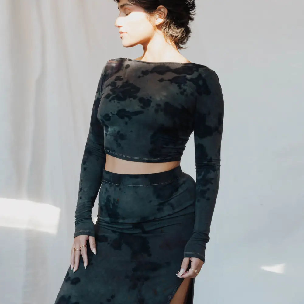 Black velvet Cait set featuring a crop top and high slit maxi skirt