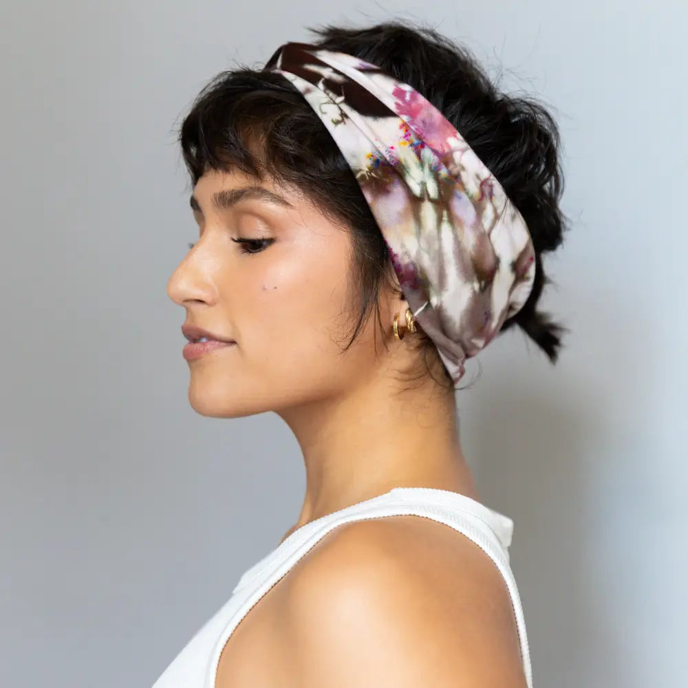 Floral silk Headband on dark hair updo showcasing BrightlyTwisted headband features