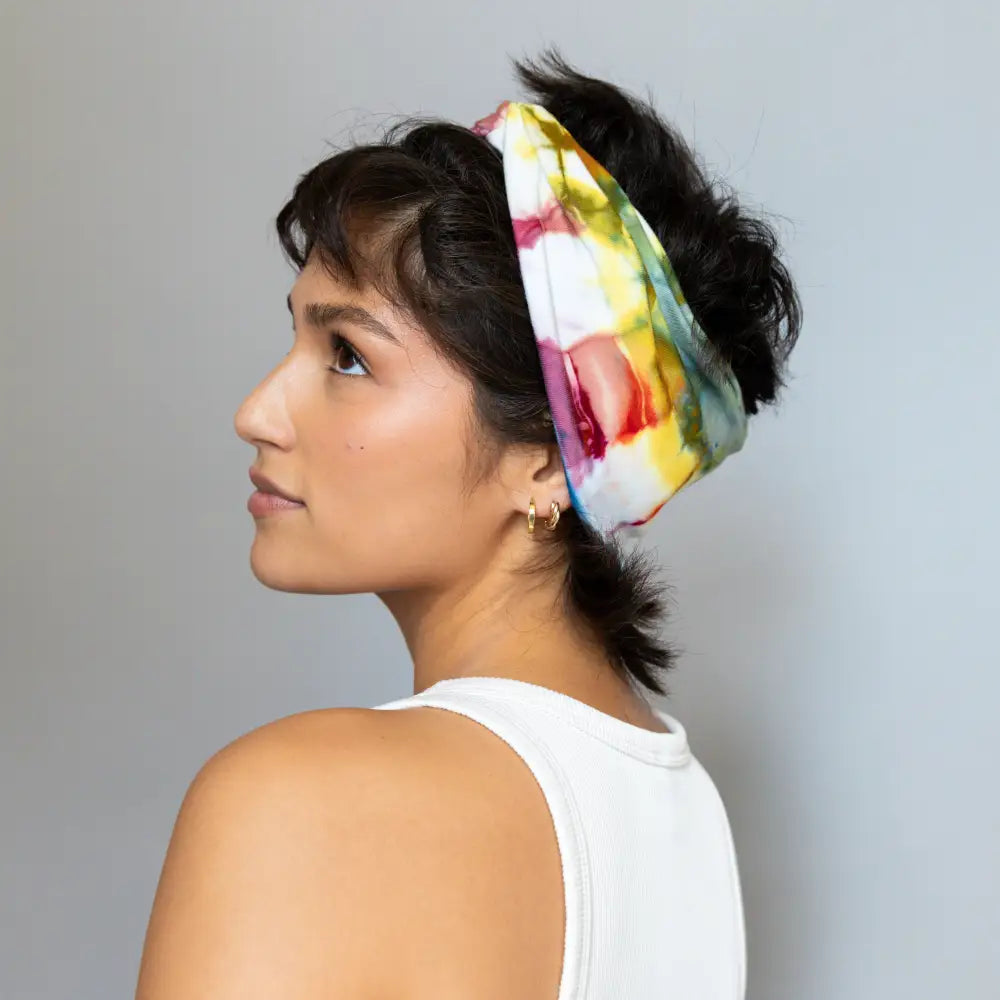 Brightlytwisted headband features a colorful tie-dye pattern as a stylish hair accessory