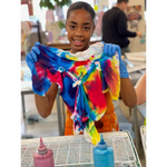 Vibrant tie dye fabric featuring swirling red, blue, and yellow patterns for CORKTOWN