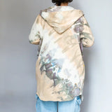 Tie-dyed beige and gray Kyle jacket worn backwards, showcasing unique style and comfort