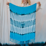 Turquoise tie-dyed scarf with fringe tassels, perfect for stylish clothing options