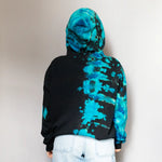 Black and turquoise tie dye crop hoodie sweatshirt from behind, perfect for trendy clothing