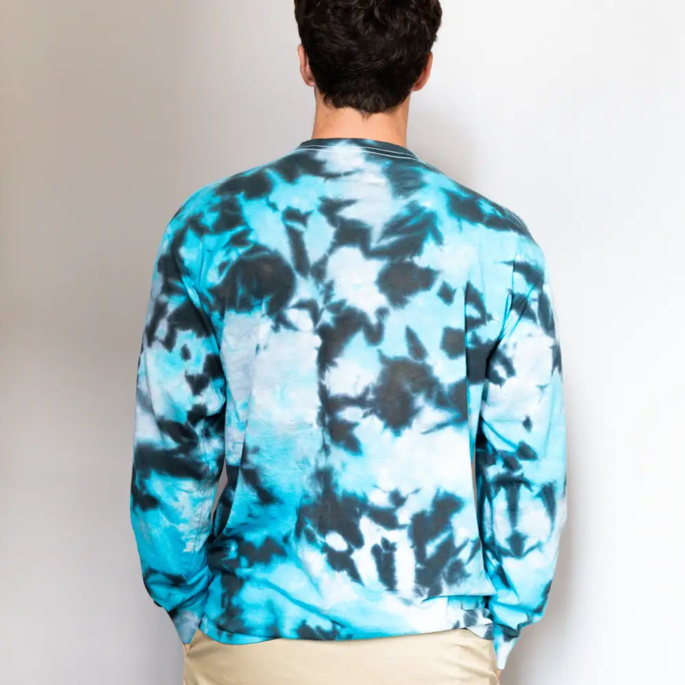 Turquoise and black tie dye long sleeve sweatshirt worn backwards in Lions Long Sleeve tee