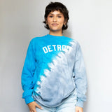 Blue and white tie-dye long sleeve sweatshirt with DETROIT text across the chest