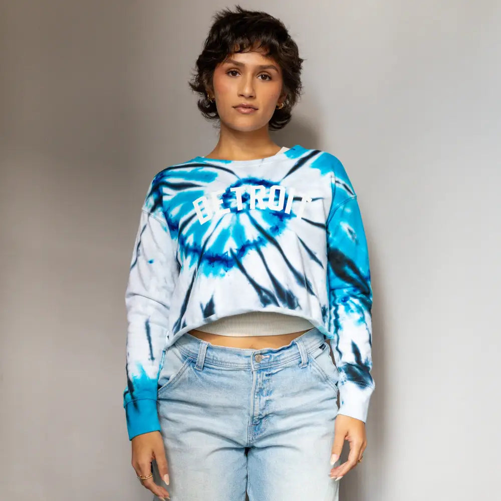 Blue and white tie-dye Lions Crop Crew sweatshirt featuring stylish text design