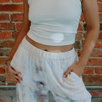 White tie-dyed sweatpants and cropped white tank top from Perfect Pant collection