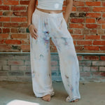 White tie-dyed Perfect Pant sweatpants with vibrant purple and blue splotches