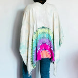 Tie dye white poncho wrap with rainbow circular pattern for vibrant clothing style