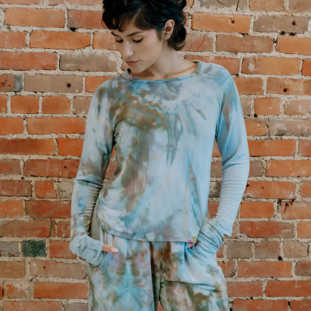 Soft Serena Top showcases a tie-dyed sweatshirt in muted blue and brown tones