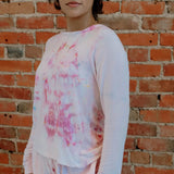 White sweatshirt with pink tie-dye splotches, featuring the Soft Serena design