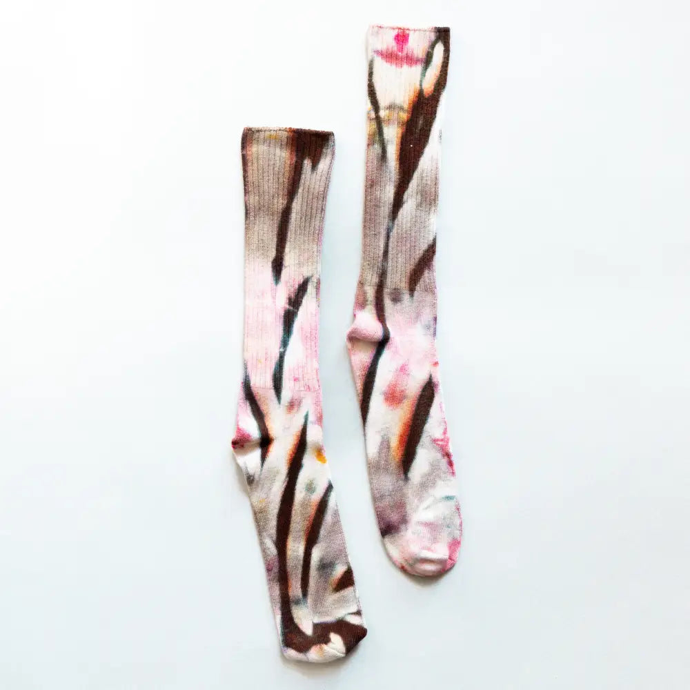 Pair of tie-dyed bamboo rayon socks in brown and pink swirling patterns