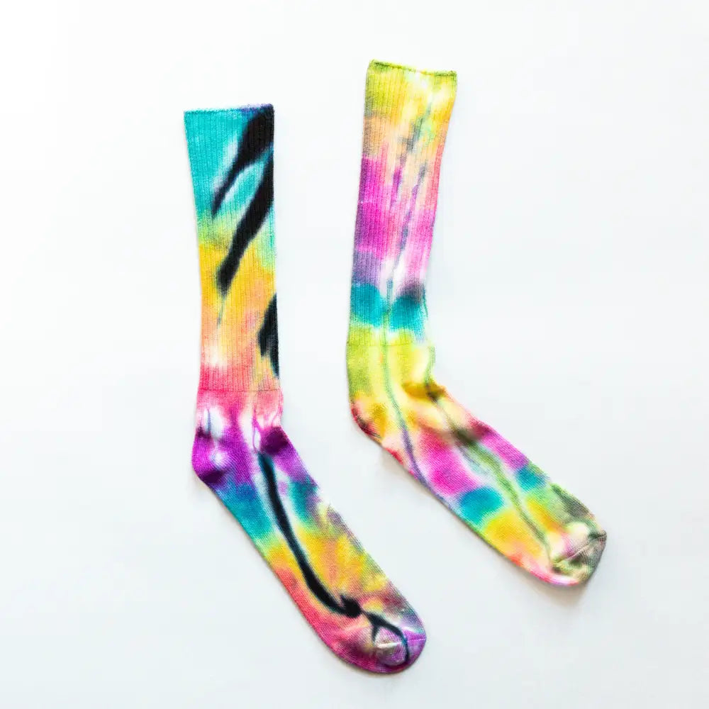 Colorful tie dye socks in pink, yellow, blue, and black made from bamboo rayon