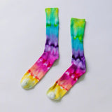 Tie-dyed bamboo rayon socks in vibrant rainbow colors with a vertical gradient pattern