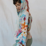 Tie-dyed Sophie pullover hoodie in pink, orange, and blue with waffle knit texture