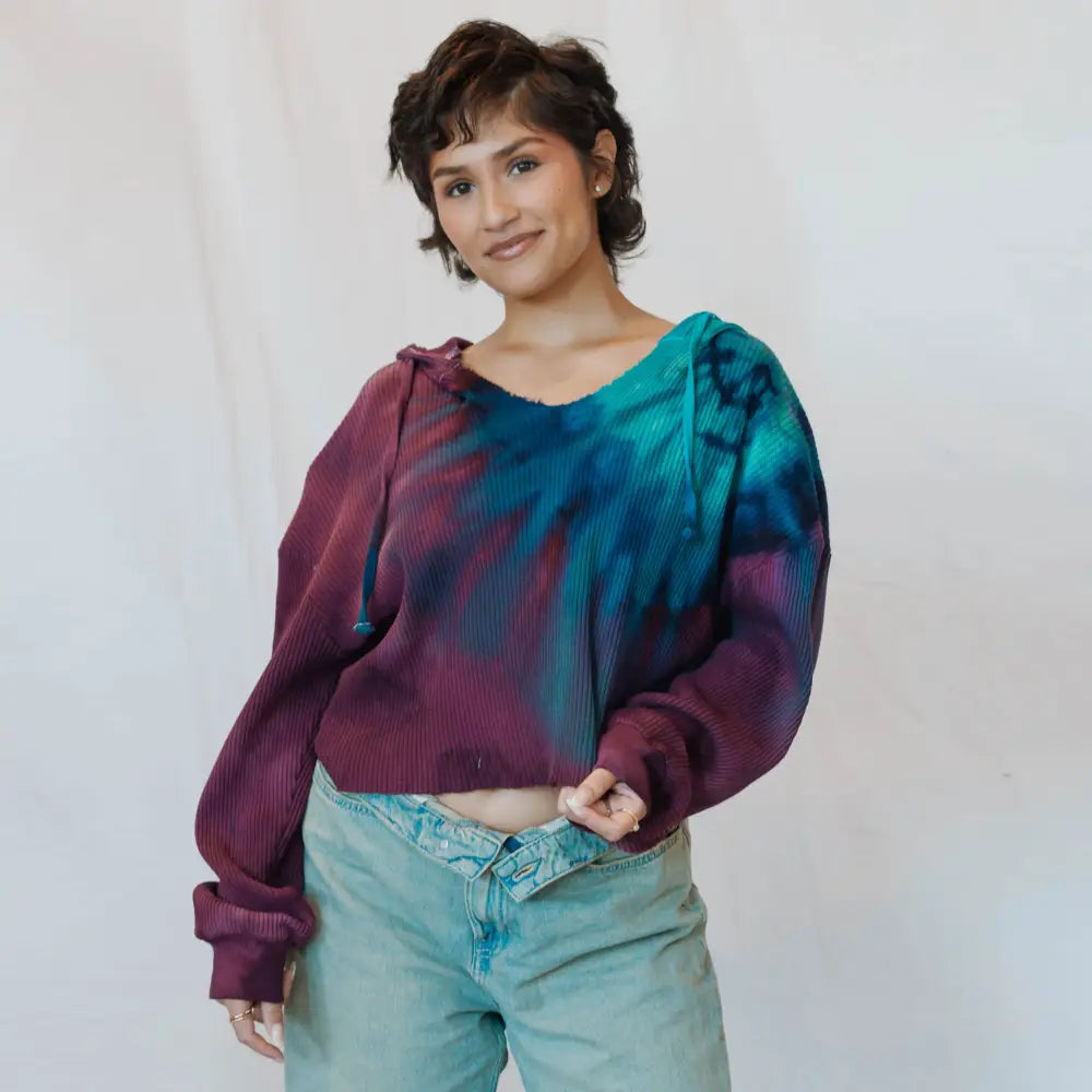 Sophie pullover featuring a tie-dyed purple and turquoise waffle knit with balloon sleeves