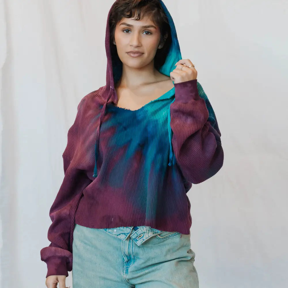 Sophie Pullover in tie-dyed purple and turquoise, styled with light denim jeans