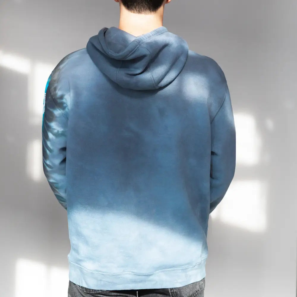 Blue gradient hooded sweatshirt from behind featuring Detroit Lions Unfinished Business design