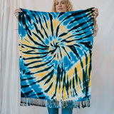 Tie-dyed blue and yellow spiral scarf with tasseled fringe for vibrant clothing style