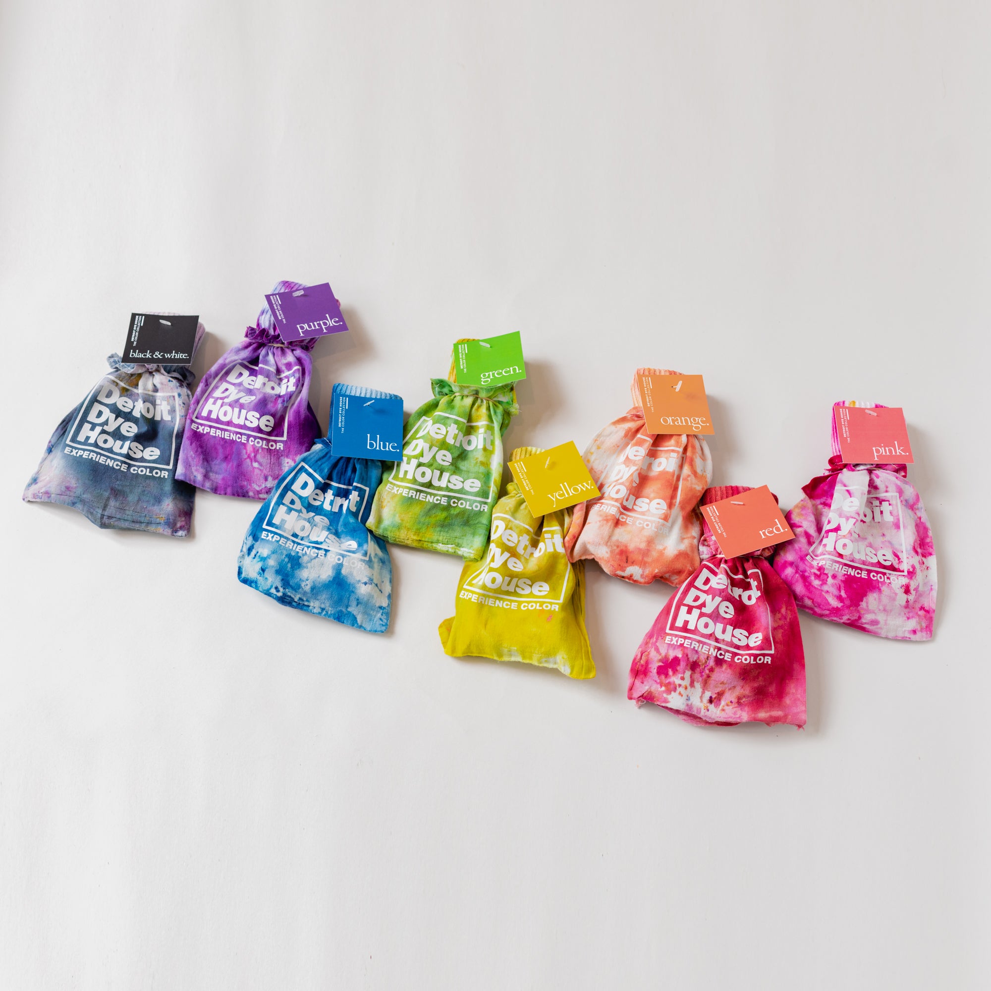 A rainbow of color socks inside their matching bags.