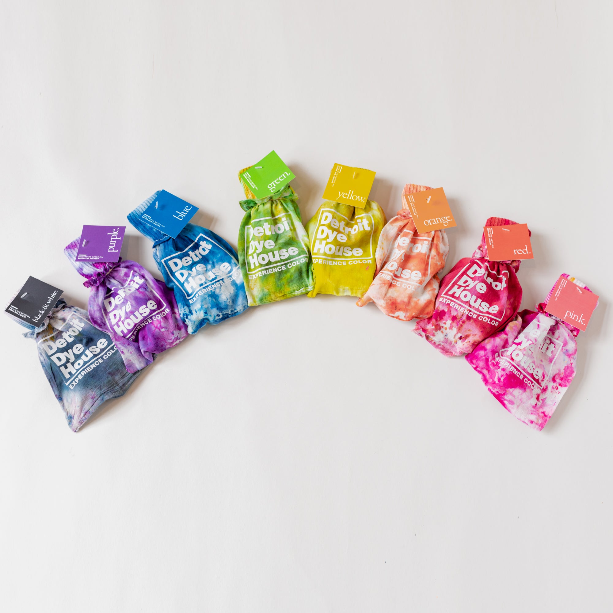 A rainbow of color socks inside their matching bags.
