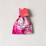 Color socks in varying pinks in a matching bag.
