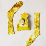 Color socks in varying yellows with a matching bag.