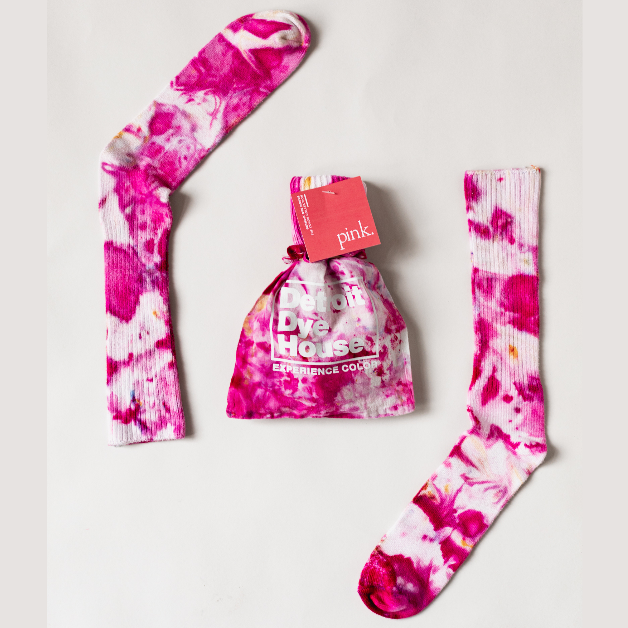 Color socks in varying pinks with a matching bag.